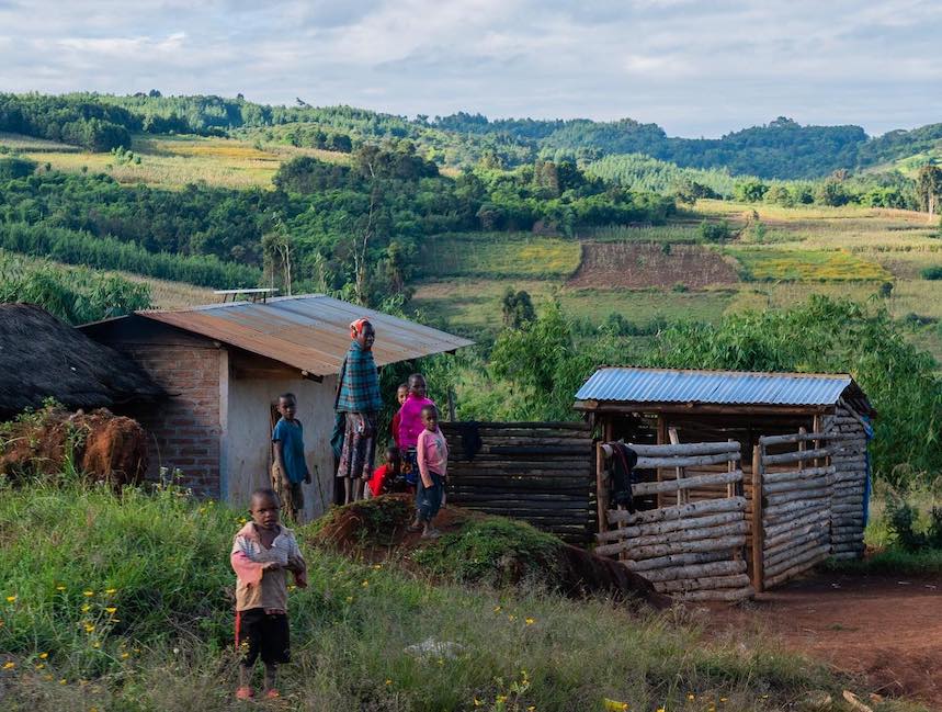 people outside a house in wangama